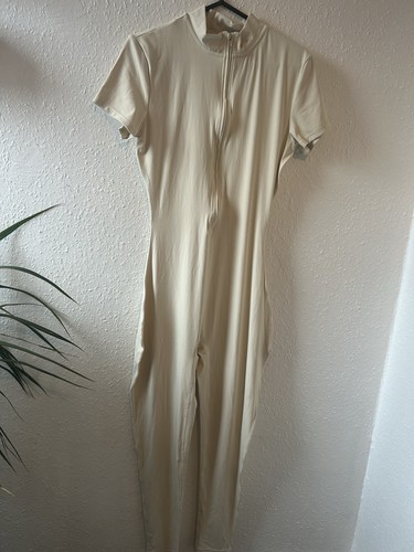 Tan and cream jumpsuit with - , a